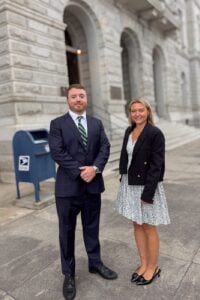 Taylor Grooms and a colleague outside the Charleston County courthouse