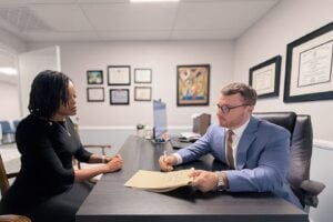 Taylor Grooms in a client consultation at Grooms Law Firm in Charleston, SC