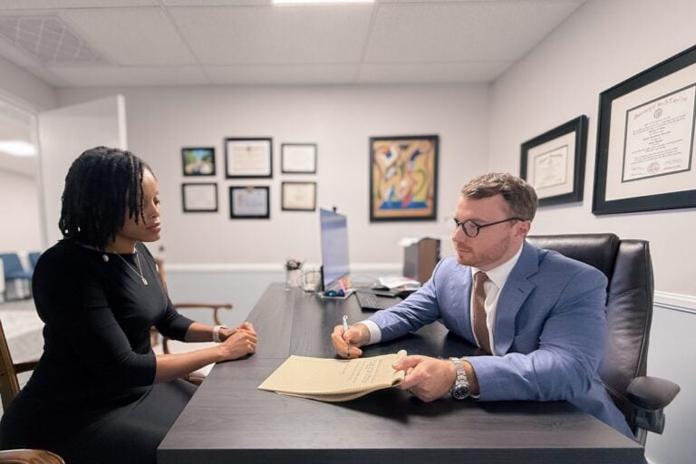 Taylor Grooms in a client consultation at Grooms Law Firm in Charleston, SC